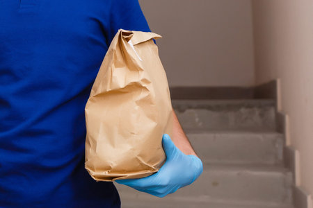 food delivery man in protective mask