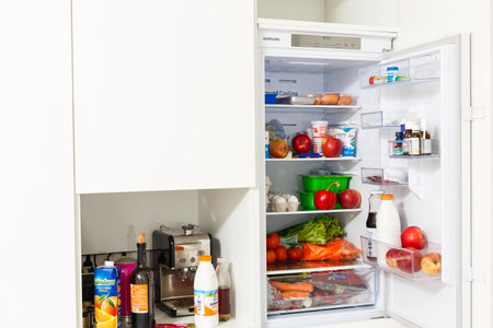 open refrigerator filled with foodの写真素材