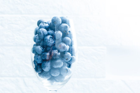 ripe blueberries in a glass goblet. Berries closeupの写真素材