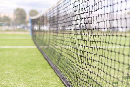 Tennis net and court. Playing Tennis. Healthy lifestyleの写真素材