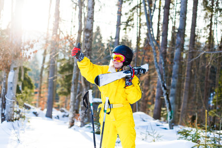 Woman skier enjoy in winter sunny day, holidayの写真素材