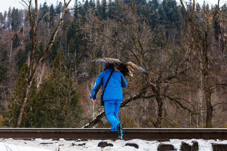 a man carries an eagle