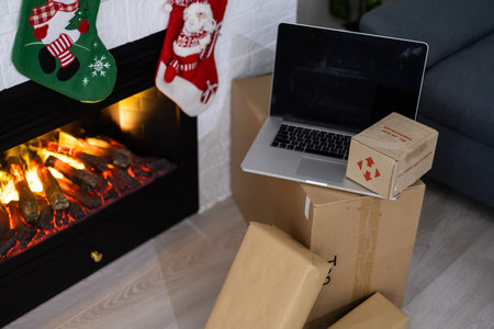 KYIV, UKRAINE - November 16, 2020: boxes Nova Poshta with delivery of Christmas gifts lie near the fireplaceのeditorial素材