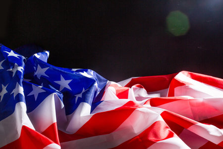 American flag lying on black background usa