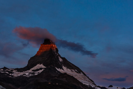 Sunny summer morning in Zermatt village with Matterhorn peak on backgroud. Beautiful outdoor scene...