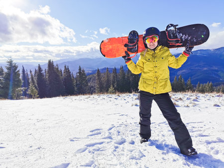 A person standing on a snow covered slopeの写真素材