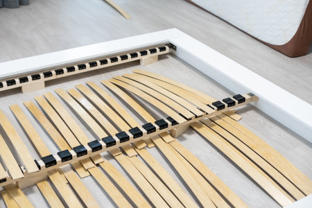 Broken wooden plank or lamella in bed. Need for furniture repair.の写真素材