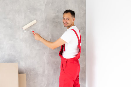 Man painting the wall background.の写真素材