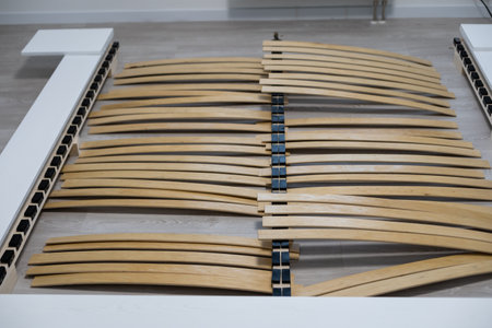 Broken wooden plank or lamella in bed. Need for furniture repair.の写真素材