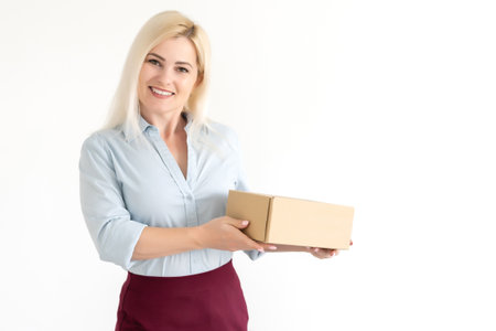picture of attractive businesswoman delivering cardboard boxの写真素材