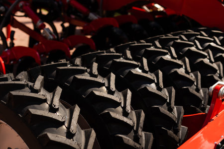 Part of agriculture machine close up with hydraulic system, steel tubes, industrial tools equipment,...