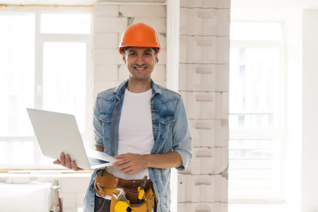 architecture and home renovation concept - foreman for renovation in the apartment