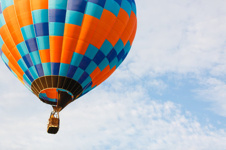 hot air balloon over blue sky. Composition of nature and blue sky backgroundの写真素材