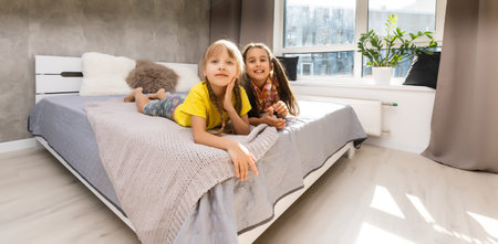 Creative cute girls, two sisters at homeの写真素材