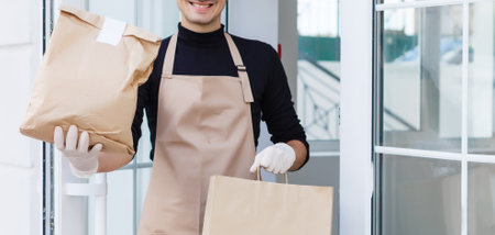 Diverse of paper containers for takeaway food. Delivery man is carryingの写真素材