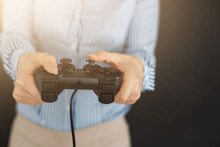 Girl playing video game with joystick.の写真素材