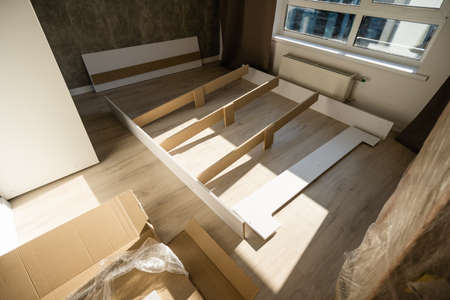 assembly of a double bed made of wood and lamellaの写真素材