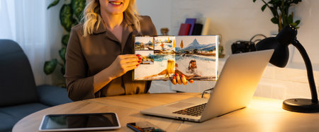 a woman holds square open family photobook, photo book. photo album.の写真素材