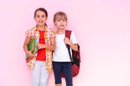 two little schoolgirls Having Fun. Friends. Emotionsの写真素材