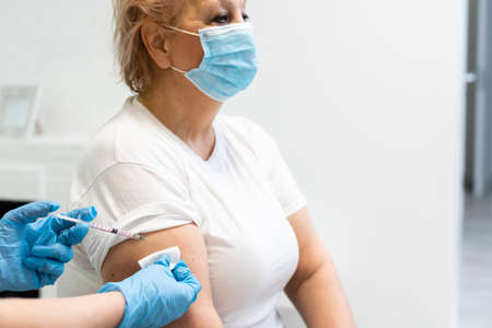 female senior getting an swine flu shot