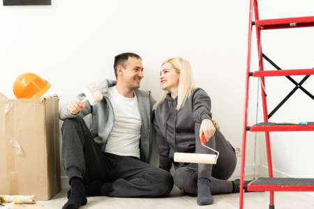 Couple redecorating home, couple makes repairs in the apartmentの写真素材