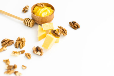 Sweet honey and nuts, isolated on white background