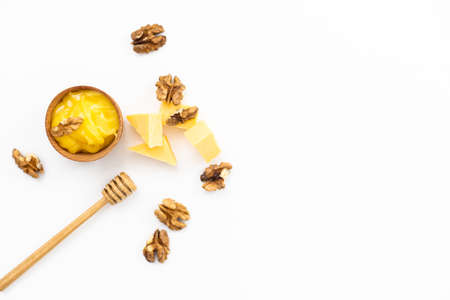 Honey and cheeses on white backgroundの写真素材