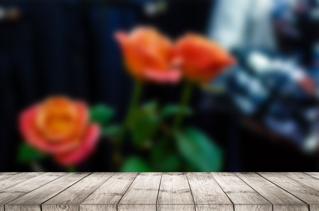 Empty top wooden table and flower blurred background. Can use for product display