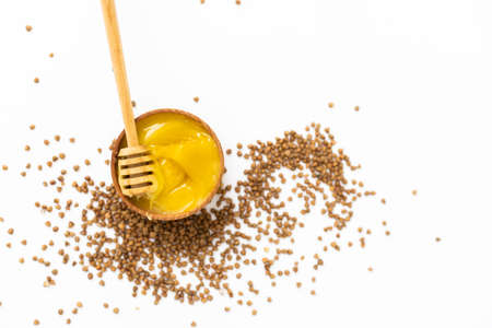 Rustic healthy breakfast set. Cooked buckwheat groats and honey on white background. Top view, copy spaceの写真素材