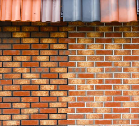 red brick wall house roof details closeupの写真素材