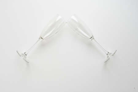 Two elegant champagne glasses on white backgroundの写真素材