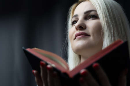 Woman reading the Holy Bible, Reading a bookの写真素材