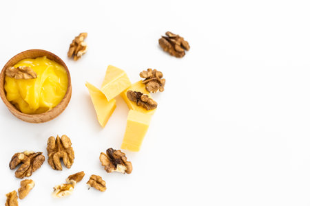 Sweet honey and nuts, isolated on white backgroundの写真素材
