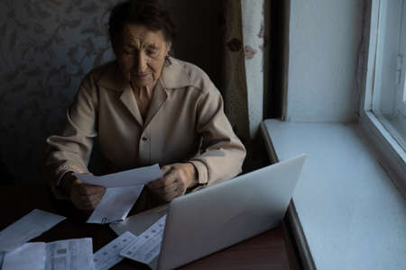 Pensioner read countless papers and is very focusedの写真素材