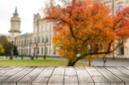 Beautiful autumn background with empty wooden deck table. Ready for product montage displayの写真素材