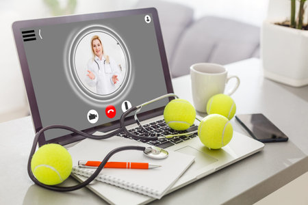 laptop with doctor on screen , online consultationの写真素材