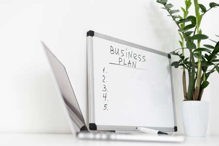 Business plan on the blackboard at homeの写真素材