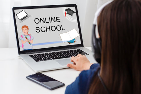 Teenage girl elearning online using computer app. Teen school student wearing headphones conferencing on laptop with remote teacher, tutor. Adolescent pupil watching web lesson learning from home.の写真素材