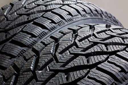 two tires on gray background