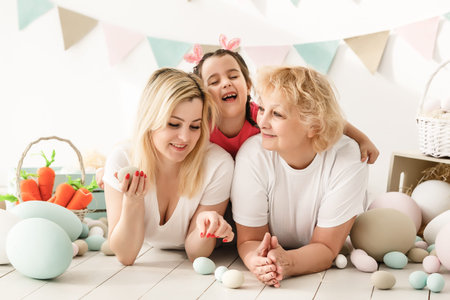happy family with easter eggs. Happy llittle girl and grandmother with Easter eggs