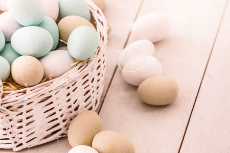 Easter eggs in the nest on rustic wooden backgroundの写真素材