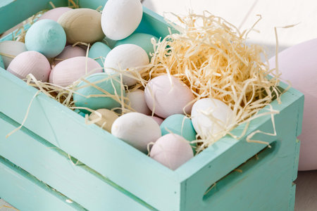 Easter eggs in a box wooden background