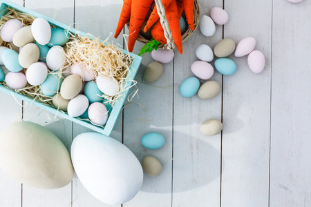 Easter eggs in the basket of wooden boards