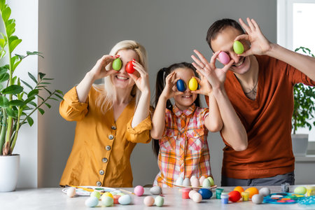 happy family with easter eggs. Happy family preparing for Easter