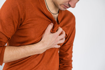 man with a pain in his chest