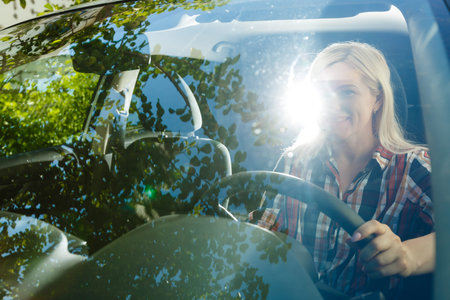 Young woman driving her car