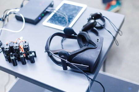 A desk with a computer mouse on a tableの写真素材