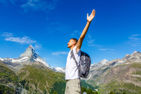 Traveler Man relaxing meditation with serene view mountains landscape Travel Lifestyle hiking concept summer vacations outdoorの写真素材