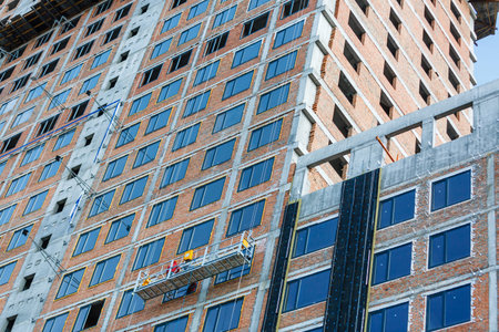 scaffolding on a building wall. building getting a new paint.