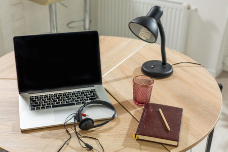 Laptop on table, home interior.